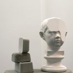 T-yong Chung, Traccia 4, 2016, concrete / Augusto Giovanile, 2016, plaster bust, 14 x 14 x 32 cm. Courtesy Otto Zoo